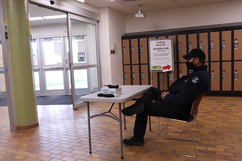 Security in charge of checking vacination proofs guards the Lethbridge College’s tech wing entrance